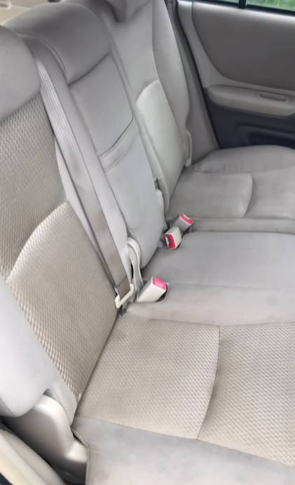 Clean rear car bench seat after mobile interior detailing
